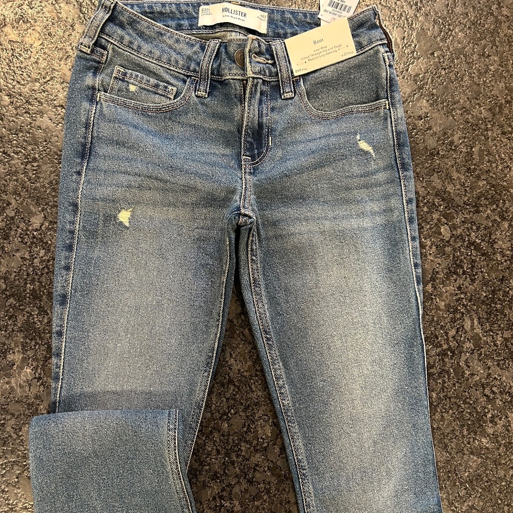 Hollister low rise distressed medium wash boot cut jeans
